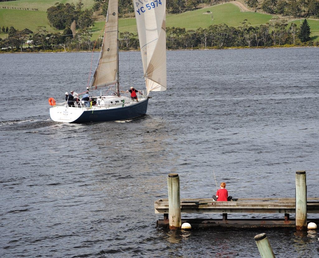 This young fisherman’s concentration was not upset by a yacht start of Shipwrights Point - Pipe Opener Series 2011 © Rob Cruse